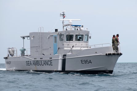 Members of the Sea Ambulance from the Maldives National Defense Force (MNDF) during a search and recovery operation in the Vaavu Atoll, Maldives