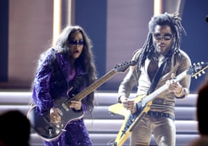 HER and Lenny Kravitz perform on stage during the 64th annual Grammy awards at the MGM Grand Garden Arena in Las Vegas