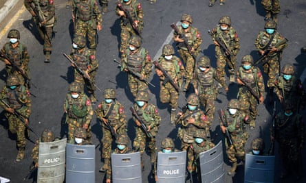 Soldiers seen from above as they walk along a Yangon street during a protest against Myanmar’s military coup