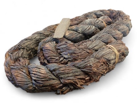 A coil of tarred rope and a wooden wedge from the Mary Rose.