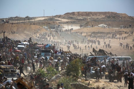 Palestinians seek aid supplies from the US-backed Gaza Humanitarian Foundation (GHF), in the central Gaza Strip, on Monday.