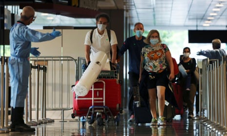 Passengers from Amsterdam arriving at Singapore’s Changi Airport today.