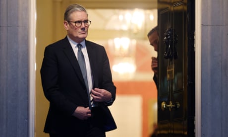 Keir Starmer standing in the doorway of 10 Downing Street