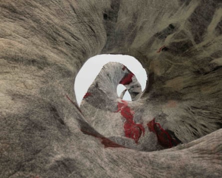 Sagarika Sundaram’s felt sculpture shows a swirling spiral opening with red thread details