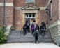 students walk into a campus building