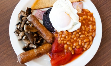 Full English breakfast, with black pudding fry up at a cafe. Fried breakfast overhead food UK.D78EJ5 Full English breakfast, with black pudding fry up at a cafe. Fried breakfast overhead food UK.
