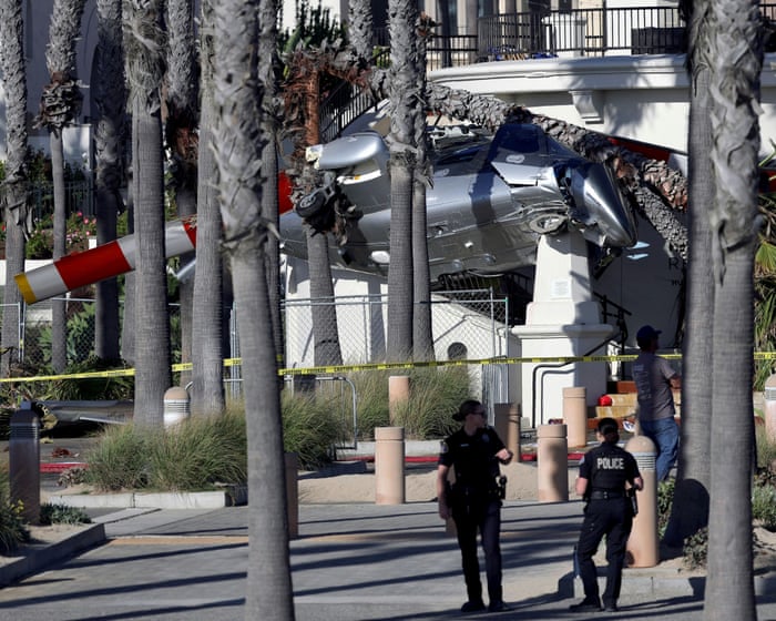 Helicopter spins out of control into palm trees at popular California beach