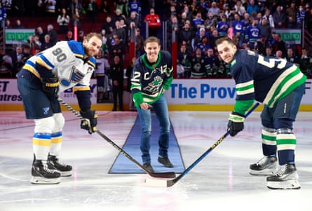 Christine Sinclair drops the puck for Bo Horvat of the Vancouver Canucks (right) and Ryan O’Reilly of the St Louis Blues before their December 2022 NHL game at Vancouver’s Rogers Arena