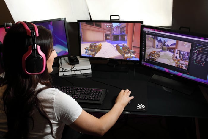 Female streamer having fun with video games online play, playing