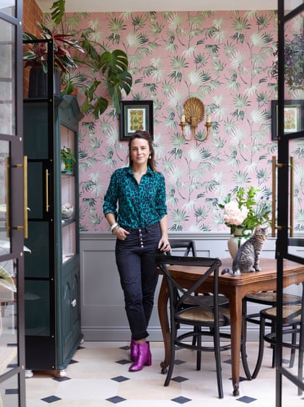 Ruthie Hudson in the garden room, with wallpaper by Pearl Lowe for Woodchip & Magnolia.