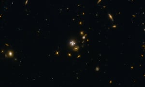 A field of distant galaxies shining in space.