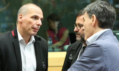 Greece’s finance minister Yanis Varoufakis, right, at the debt summit in Brussels.