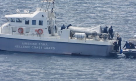 12 asylum seekers are filmed being transferred to a Hellenic coast guard vessel