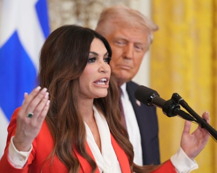 Kimberly Guilfoyle speaks as Donald Trump watches on.