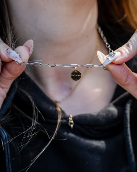 A BTS fan shows off a necklace