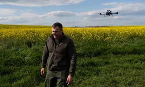 Ukrainian military commander Roman Kostenko with a drone unit above a rape field in southern Ukraine.