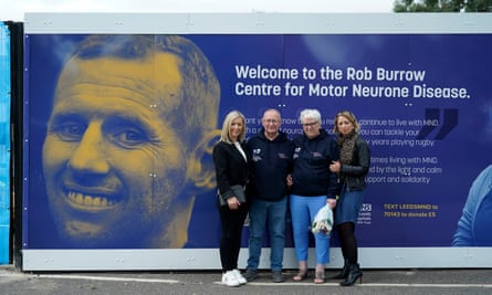 Rob Burrow’s sister Claire Burnett, father, Geoff Burrow, mother Irene Burrow and sister Joanne Hartshorn, in front of a poster reading: ‘Welcome to the Rob Burrow Centre for Motor Neurone Disease.’