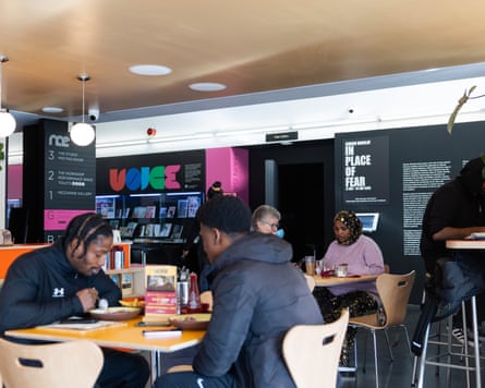 People sat at tables in a cafe