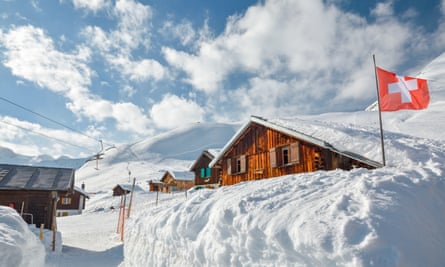 Wooden huts covered by snow near Andermatt/Sedrun