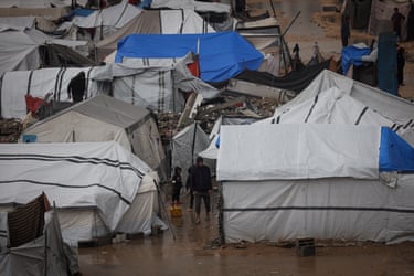 White tents surrounded by floods in Gaza