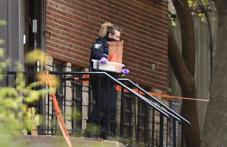 A police officer exits the Yeshiva Gedolah Jewish school