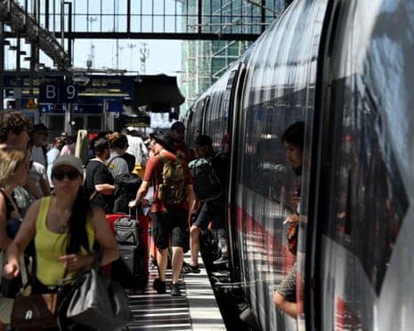 Passengers board an fast train of German rail operator Deutsche Bahn in Frankfurt am Main, western Germany.
