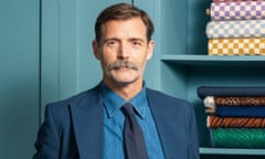 Patrick Grant, host of the BBC show The Great British Sewing Bee, in a blue suit and tie