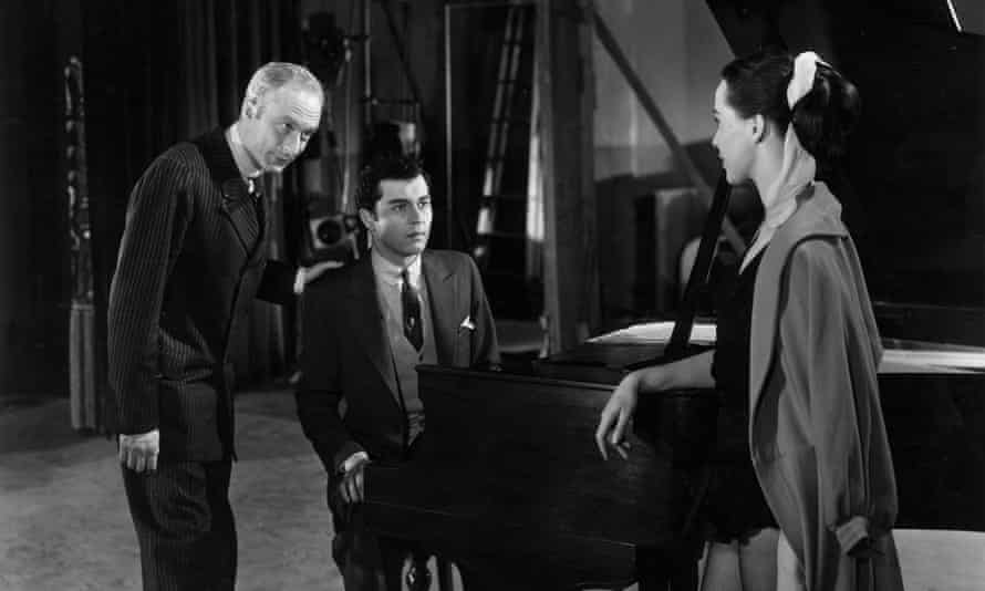 Norman Lloyd, Sydney Chaplin Jr (at the piano) and Clare Bloom in a scene from Charlie Chaplin’s Limelight, 1952