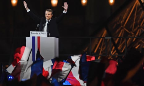 Emmanuel Macron waves to his supporters at the celebration of his election victory at the Louvre, Paris.