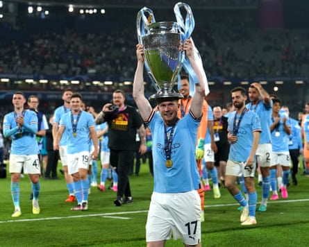 Kevin De Bruyne holds aloft the Champions League trophy after Manchester City beat Inter in the 2023 final.