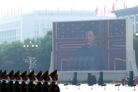 A display shows China’s President Xi Jinping