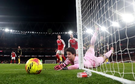 Senne Lammens makes a save against Arsenal