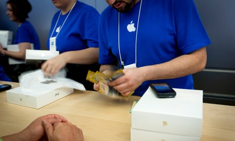 A customer purchases an iPad at the Apple store in George Street, Sydney.