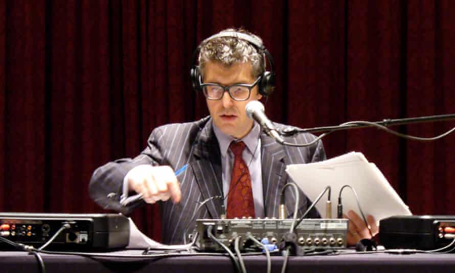 Ira Glass live on stage playing excerpts from This American Life.