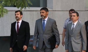 Josep Lluís Trapero, centre, the head of the Mossos d’Esquadra, the Catalan regional police force, returns to the High Court following a break in proceedings in Madrid.