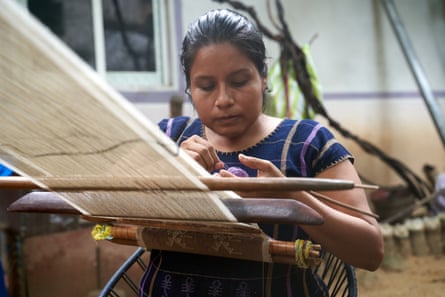A Mixtec woman weaving on a loom