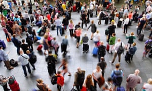 commuters at busy train station