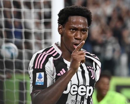 Jonathan David successful nan caller Juventus shirt, pinch badge and stars successful a bold shadiness of pink.