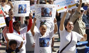 People wave placards during an immigration rally and protest in downtown Denver on Saturday. 5309.jpg?w=300&q=55&auto=format&usm=12&f