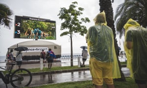 Spectators watching the action on a giant screen during the first stage in Nice.