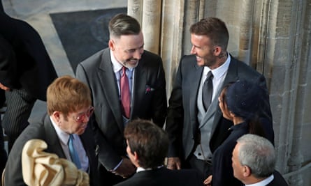 Sir Elton John (L) and David Furnish (2nd L) with the Beckhams inside the chapel.