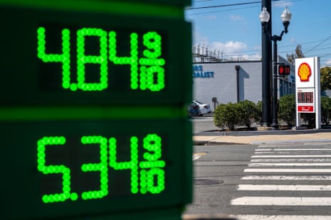 Illuminated gas price signs show $4.84 and $5.34 near a Shell station in Arlington