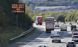 A sign on the M4 near Cardiff in Wales reminds motorists of coronavirus rules.