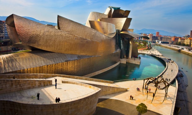 Modern architecture in Bilbao.Guggenheim Museum by Frank Gehry architect and Maman Sculpture by Louise Bourgeois.
