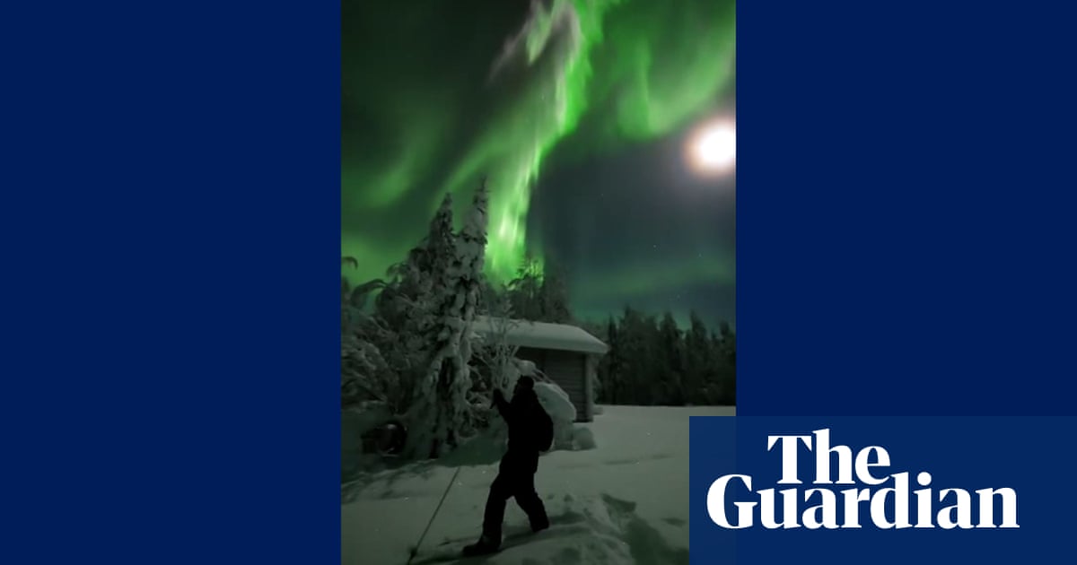 Skier captures spectacular northern lights display in Finland – video