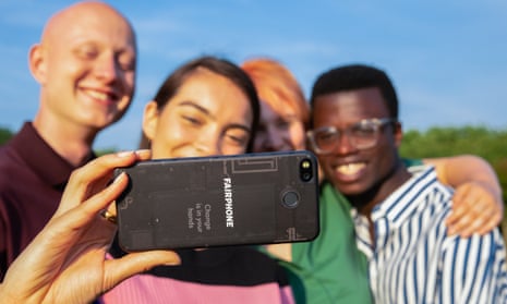 A group of people posing for a photo being taken on a Fairphone 3 smartphone