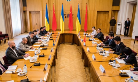 Ukrainian foreign minister Dmytro Kuleba, centre left, meets Chinese envoy Li Hui, center right, in Kyiv.
