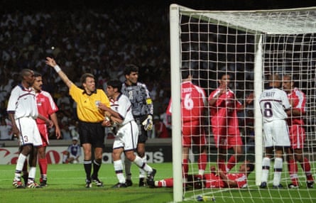 Tempers flair in the goal net between USA’s Earnie Stewart (second right) and Iran’s Mohammad Khakpour (right) as referee Urs Meier awards the goal for the USA at France ‘98.