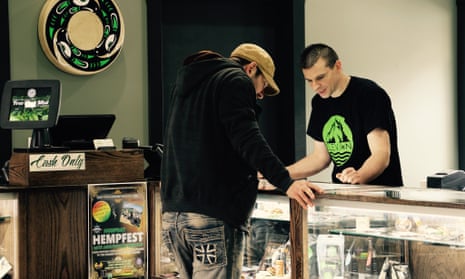 An Elevation staff member describes the locally produced product grown within an hour of the Native American owned and run cannabis store on the Squaxin Island tribe’s reservation in Washington.