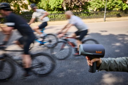 A handheld speedometer measuring cyclists on the Outer Ring